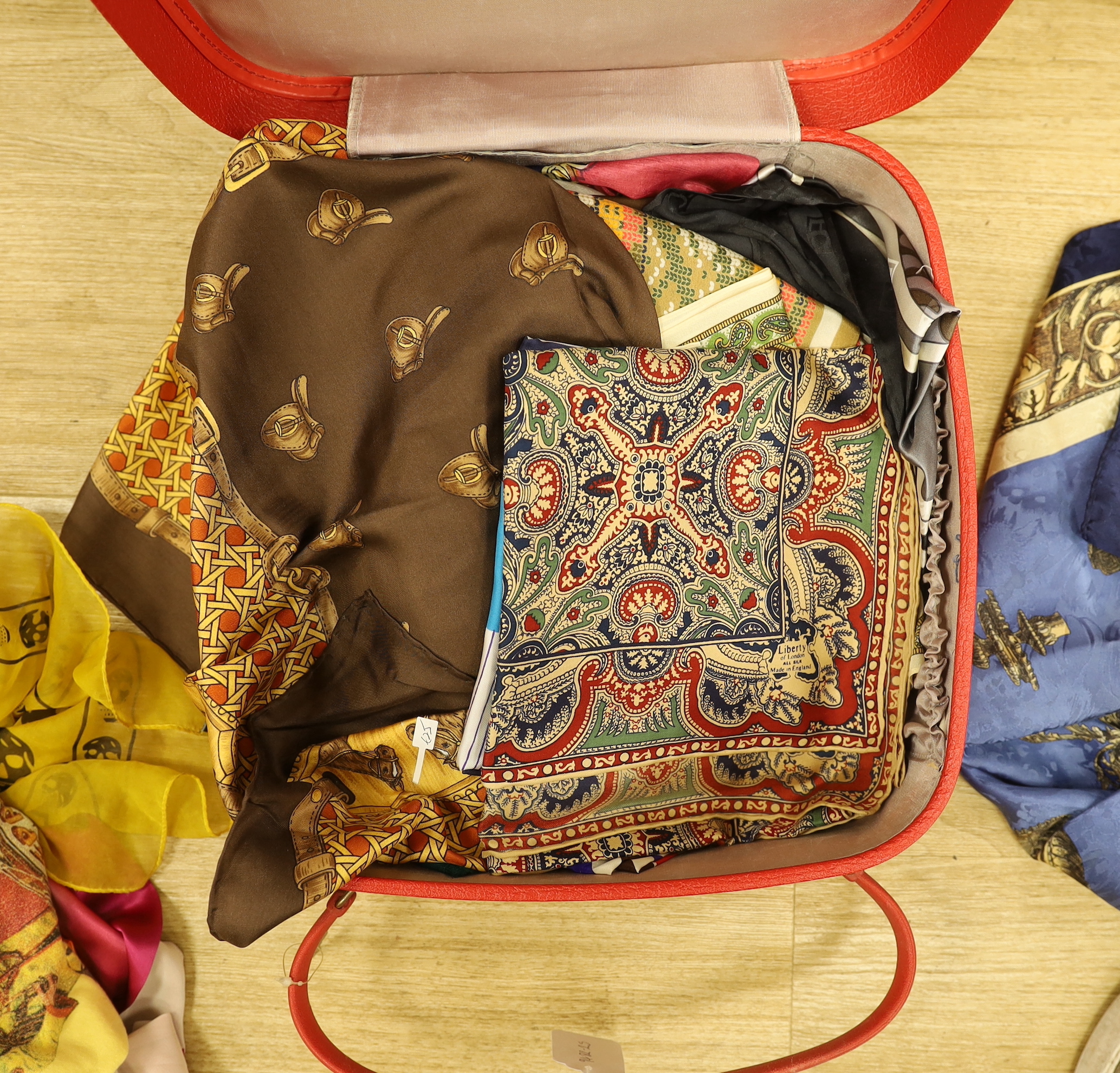 A quantity of various silk scarves etc.